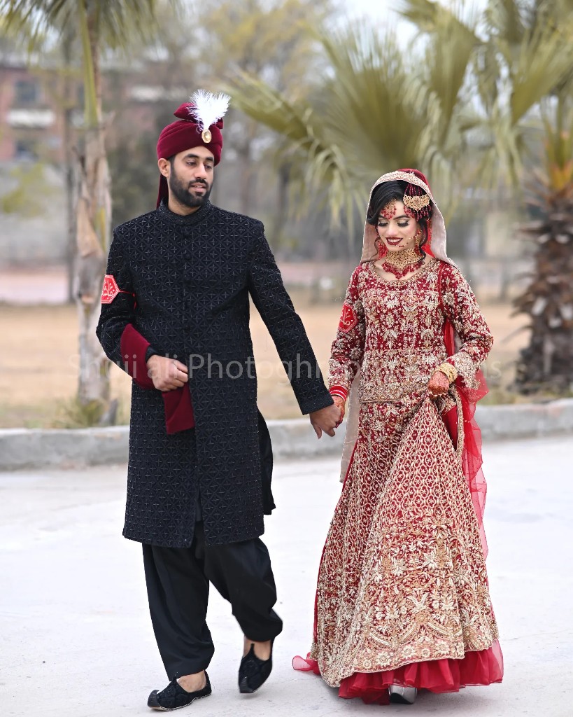 Couple in traditional wedding attire walking together